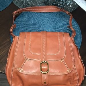 Levenger rust colored purse.